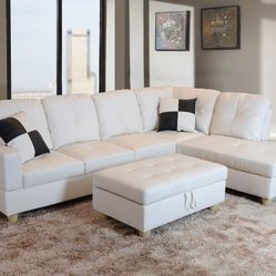 New White Leather Sectional And Ottoman 