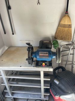 Bench grinder and buffer on a Taco Bell table