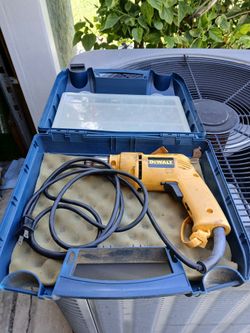 Dewalt 3/8 electric drill with case.