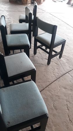 Six wooden cushioned chairs
