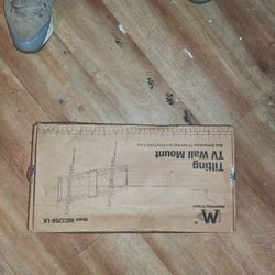 The item is a Mounting Dream tilting TV wall mount (Model MD2268-LK). 