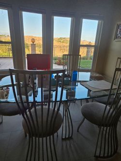 Glass dining table with 6 chairs