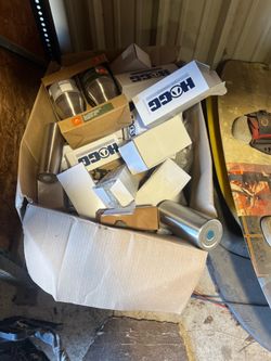 Box of various sizes of stainless tumblers