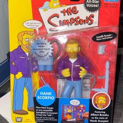 Selling a brand-new, sealed The Simpsons Hank Scorpio action figure from the World of Springfield series by Playmates. Package is in great shape, bubb