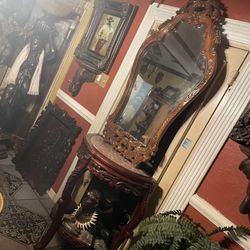 Hand carved entrance table set 2 Pieces: table & Mirror Table is 2 Tiers Marble top 36in H By 30inW By 18inD Mirror is: 54in H by 30in W Solid hand ca