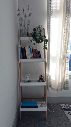 Light-wood four-tier ladder bookcase