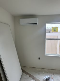 Variable frequency split heating and cooling air conditioner