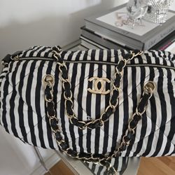 Chanel shoulder bag with bold black and white vertical stripes. 