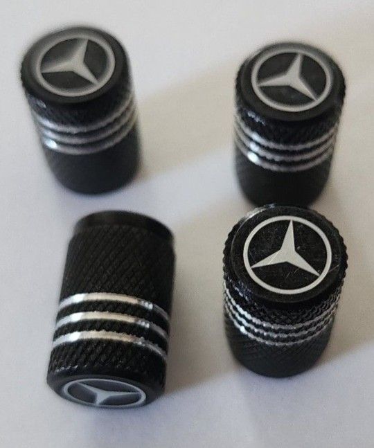 4 New Mercedes Tire Air valve Caps. PUDDLE LIGHTS CENTER CAPS ETC SOLD SEPARATELY SHIPPING AVAILABLE 