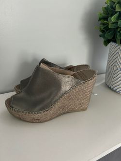 Cici in Pewter   Metallic leather upper Slip on Almond shaped peep toe Leather insole Rubber sole Made in Spain Measurements: Heel height:  4" Platfor