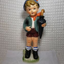 Vintage Betson's hand painted Dutch boy figurine with umbrella 12" tall .  Figurine 