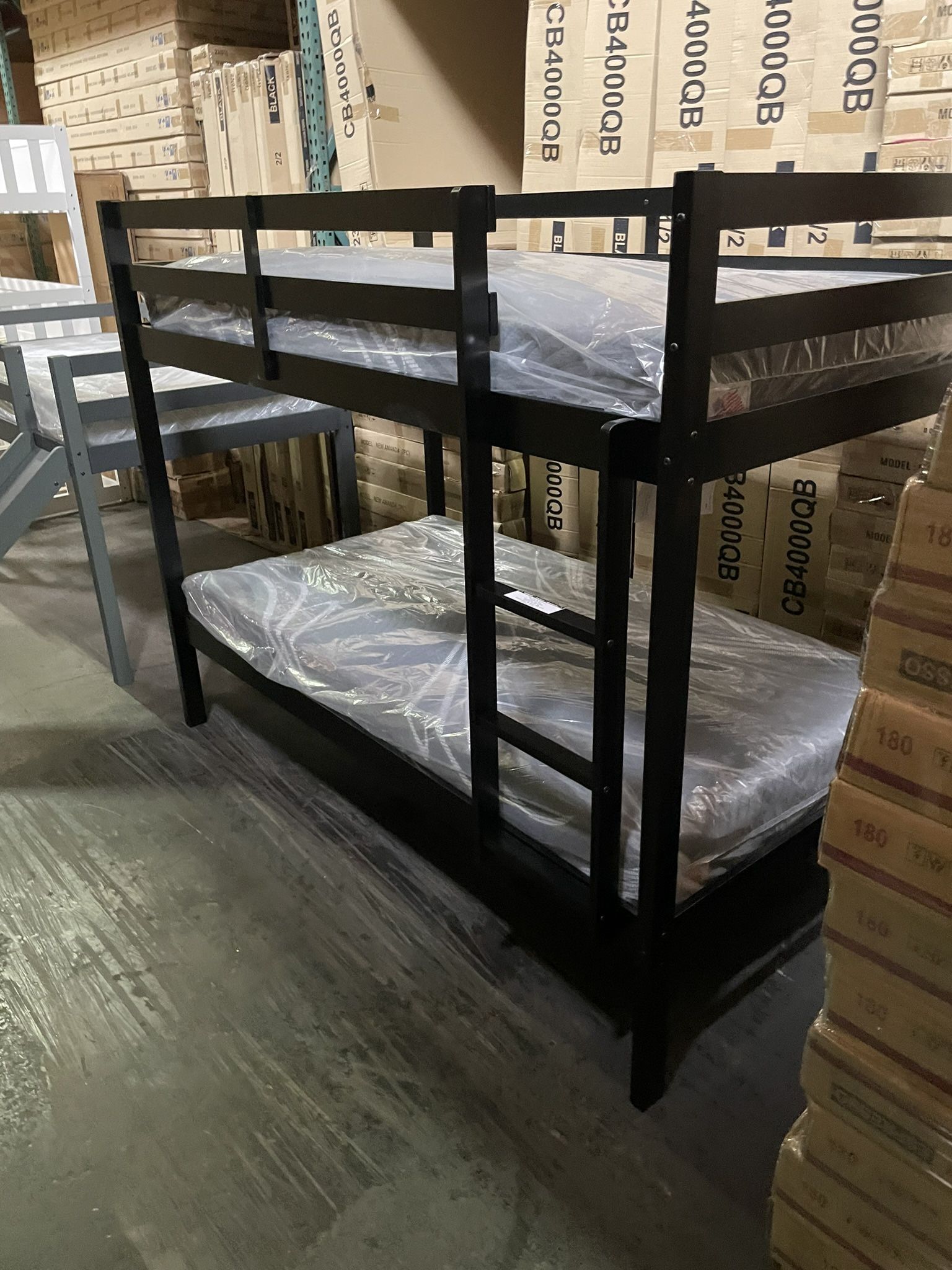 Twin bunk bed. Available in espresso, white, & grey. Bunk bed only-$220. With mattresses-$399. Assembly required. Assembly not included. Tax included.