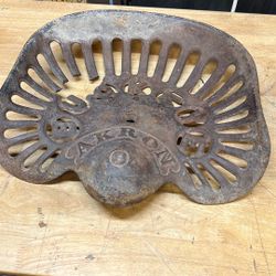 Vintage tractor seat, cast-iron small piece broken in back retails for 210 selling for 80
