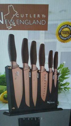 Brand New In Box 7 pc. New England Cutlery Titanium Coated knife set and knife holder block.