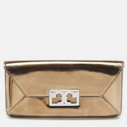 New with tag Comes with dust bag OBO Has some minor dents from moving The Tory Burch Metallic Leather Gigi Clutch is a stylish and elegant accessory f