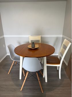 Deop-leaf wooden table and two matching chairs