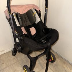 Doona Infant Car Seat & Stroller Combo - Black with Pink Insert