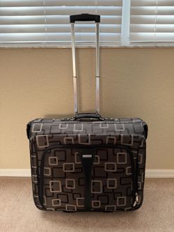 Like New Fold Over Garment Clothing Suitcase on Wheels. Comes with 4 Hangers