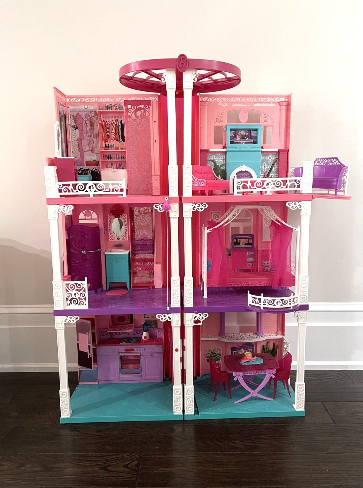 Life size Barbie Dream House. Working sounds: toilet flushing, hairdryer, doorbell, music. Used, but still has a lot of life left in it. Has normal