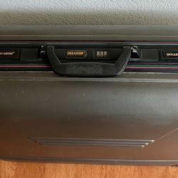 ~~OKKASION Hard Shell Luggage– Excellent condition, used once for a national trip. Clean inside, durable case, combo lock & smooth wheels.