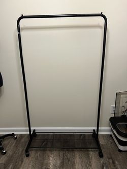 Black rolling clothes rack
