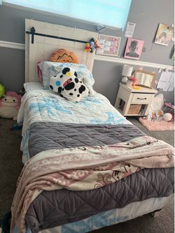 Rustic white twin bed and nightstand