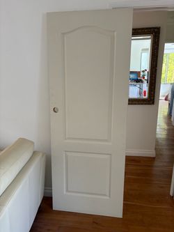 79 1/2” tall x 30” tall modern curved Arch two panel door primed, and ready to go, brand new