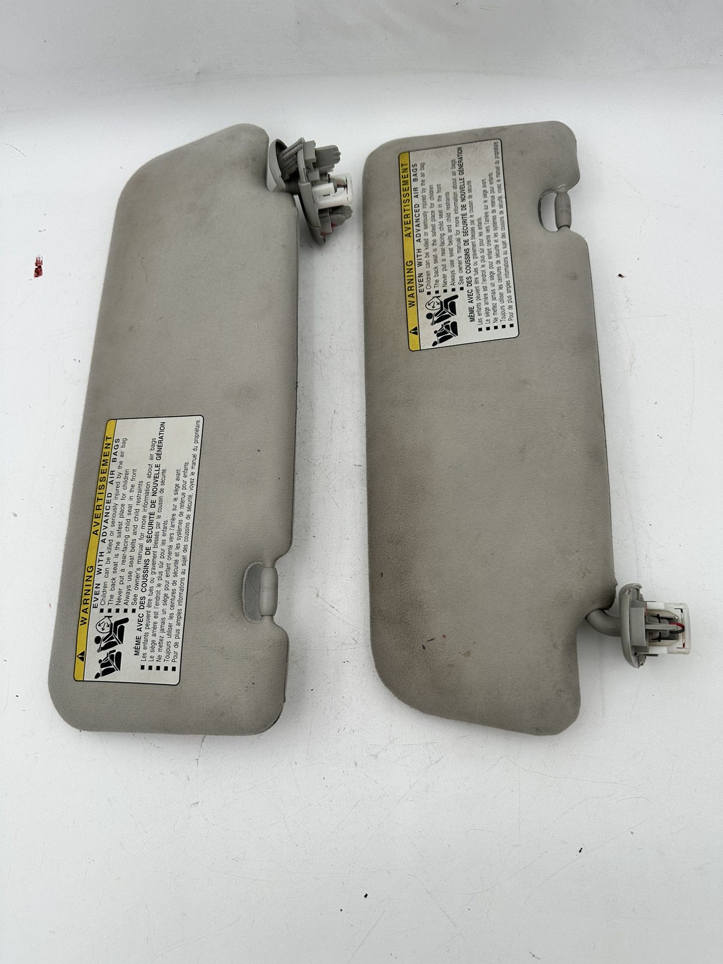 2010 to 2015 Toyota Prius Driver & Passenger Sun Visor Pair Gray Cloth OEM