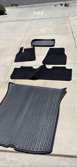 Tesla Model Y OEM floor mats and 3rd party plastic trunk plus frunk liner plus dashboard cover