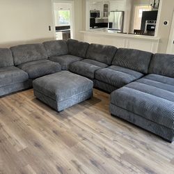 New 7 Piece Corduroy Fabric Sectional.  Grey.  127” X 164” X 66”.  Free Delivery!