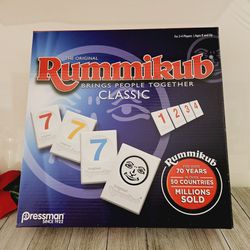 The Original Rummikub Bring People Together Classic Game. For 2-4 Players Ages 8+ by Pressman Toy Corporation. 

Pre-owned open box in never used cond
