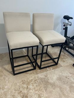 2 cream color bar stools
