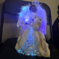 This is a fiber optic angel Christmas tree topper. 