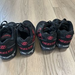 Two Pairs Of Heeleys