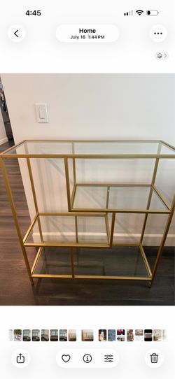Brass / gold , display shelf furniture piece