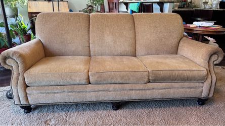Matching Clayton, Marcus, couch and loveseat set tan with removable brown velvet covers