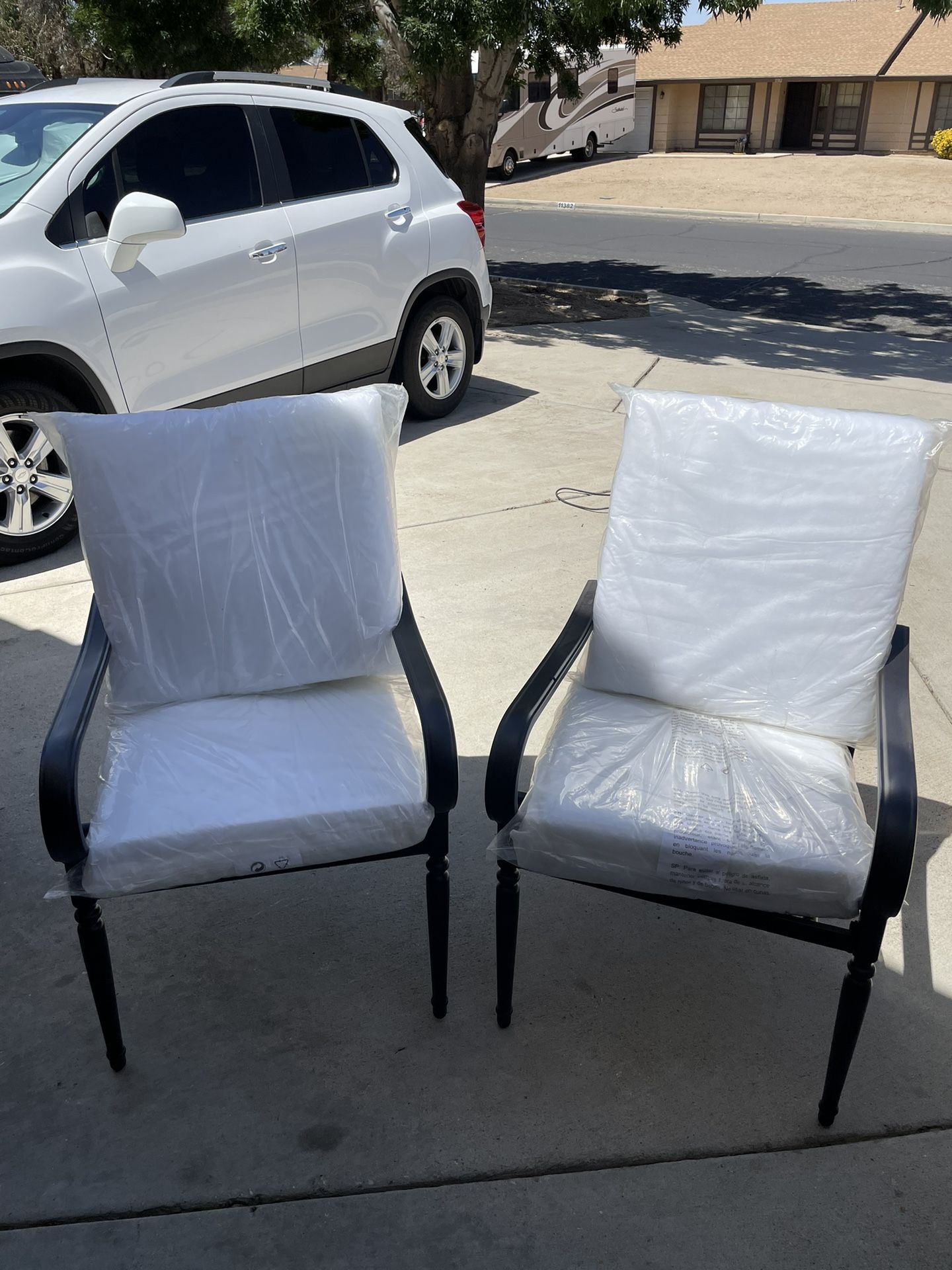 New Hampton Bay steel BARE cushion patio chairs. 2 chairs to a box $80 a pair. Very durable and easy to clean. Comes with cushions but you have to pur