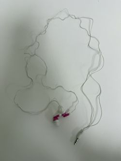 Pink and white wired earbuds with 3.5mm jack.