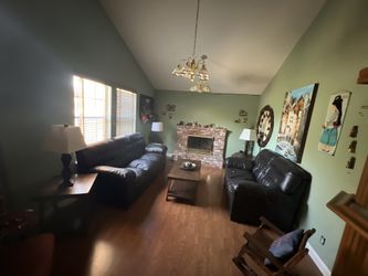 Leather Couches With Tables and Lamps