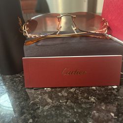 Red Tinted Diamond Cut Cartier Frames With Gold Arms