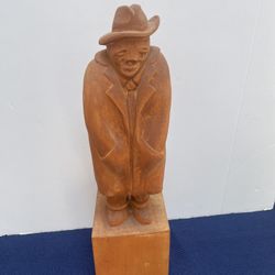 hand-carved wooden figure