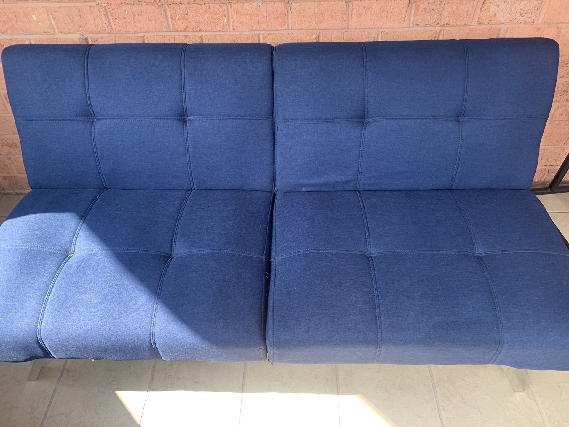 Blue futon sofa couch