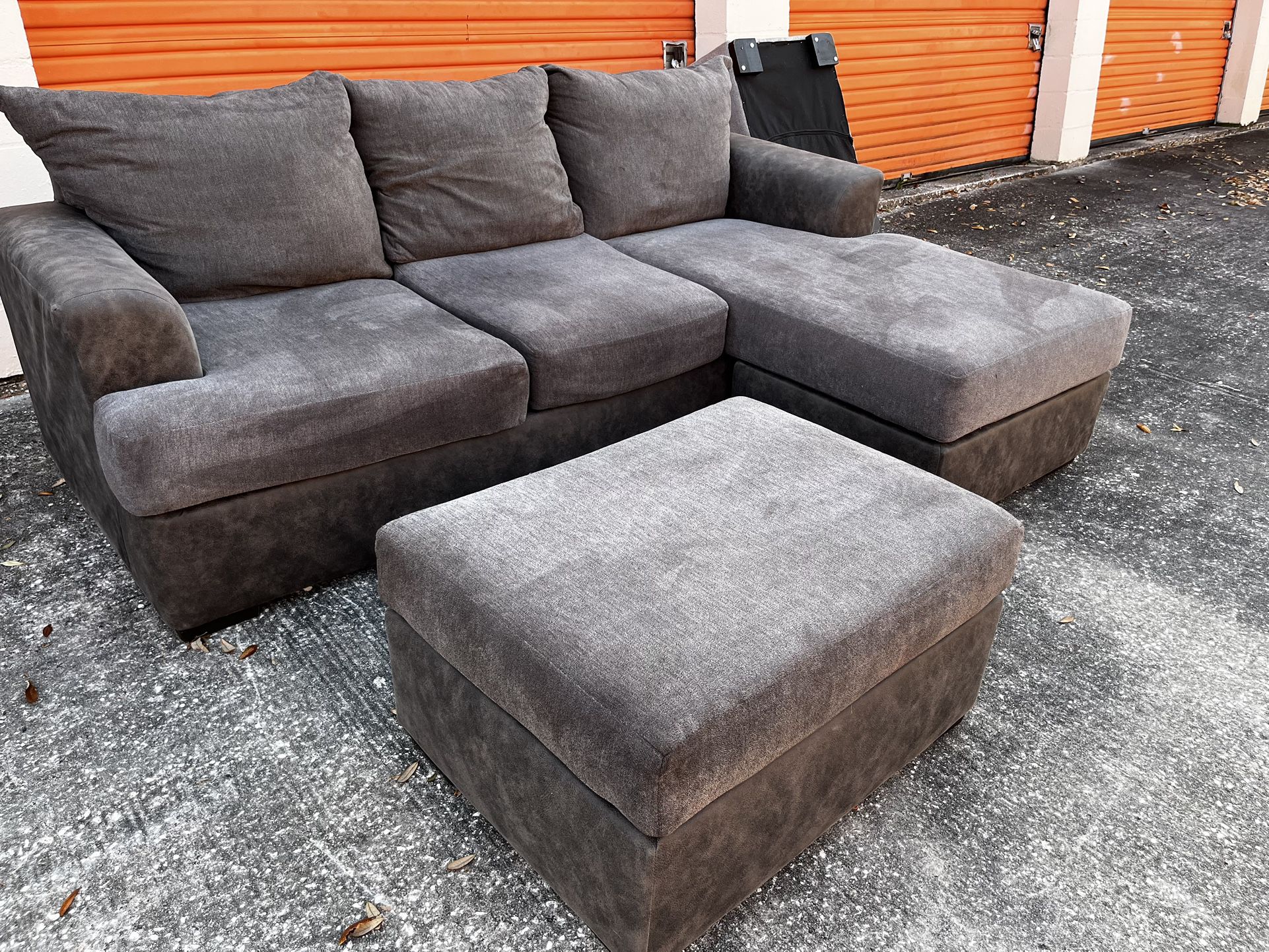 Nice gray Sectional Couch w/ ottoman. Delivery Available!