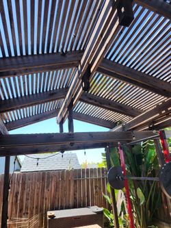 Wood pergola 18feet long x 8 feet wide about 13 feet high