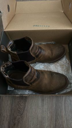 Used water proof boots left is missing sole