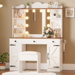 White farmhouse style vanity desk with lights, stool, and charging ports