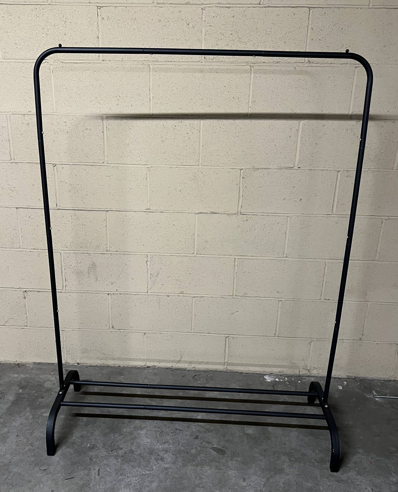Garment Rack 43.5” W x 58” H, Base is 16” D. Can Put Shoes On Bottom. Stationary, Not On Wheels. 