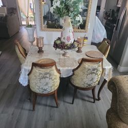 A eating table  With 6 Chairs And Without all the things on top of the table 