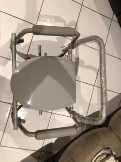 Deluxe Steel Drop Arm Commode