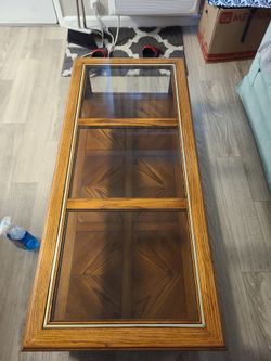 Nice three piece glass top coffee table